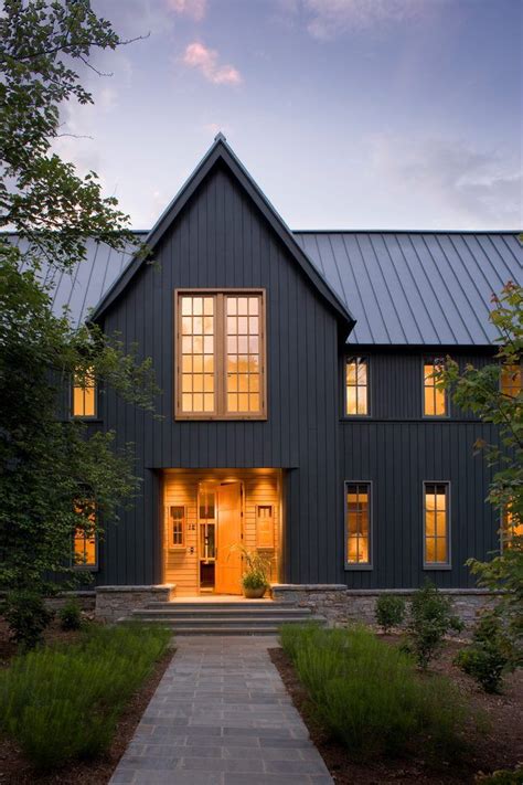 grey house with black metal roof|grey houses with black shutters.